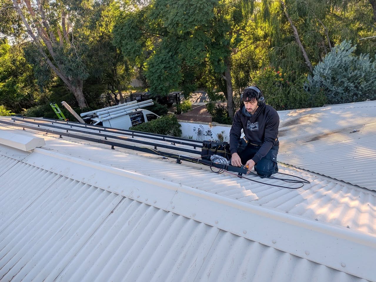PSA team member preparing a residential roof for solar panels